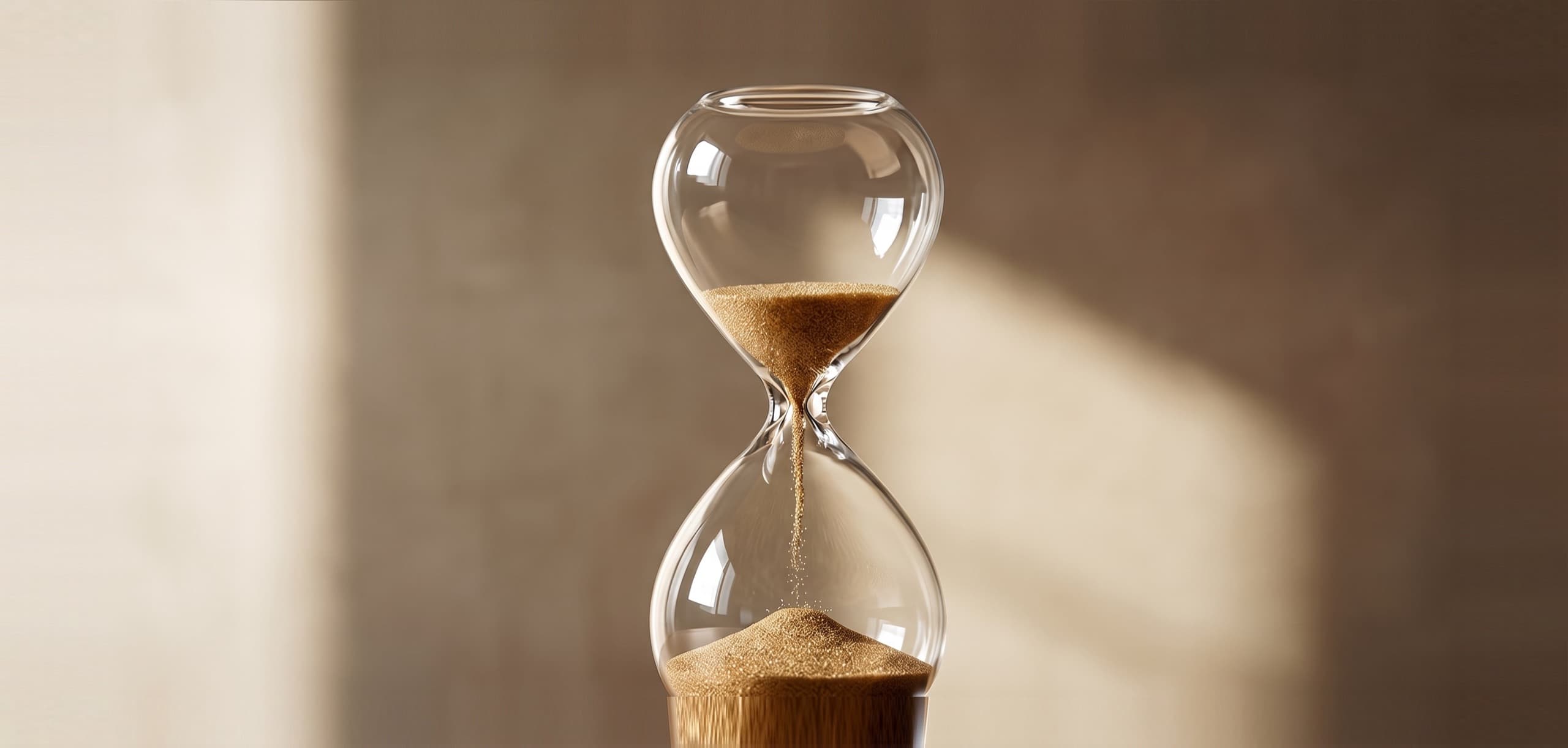 Hourglass on a warm sunlit surface